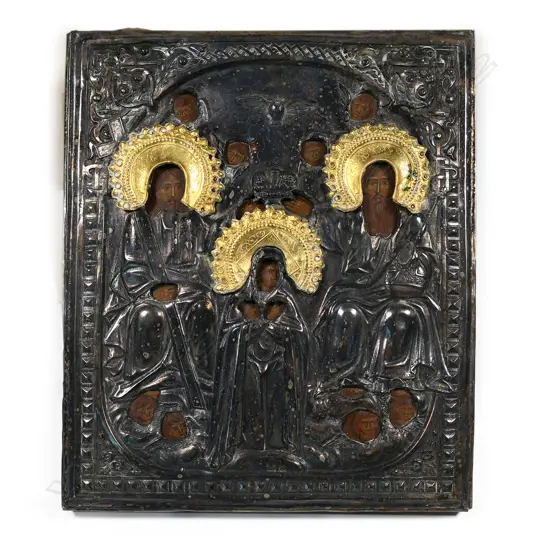 A decorative Russian icon with repoussé silver plate oklad, the halos with gilding framing the apertures revealing painted faces. 290 x 245mm