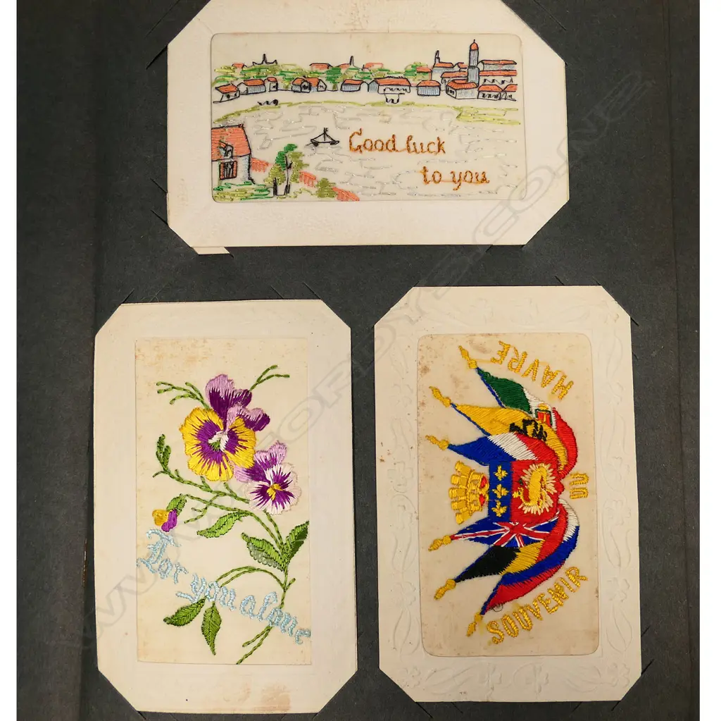 An early 20thC postcard album, with one hundred and twenty-four silk post cards, including many from WWI, souvenir, greetings and good luck cards, all in good condition. Image 1++