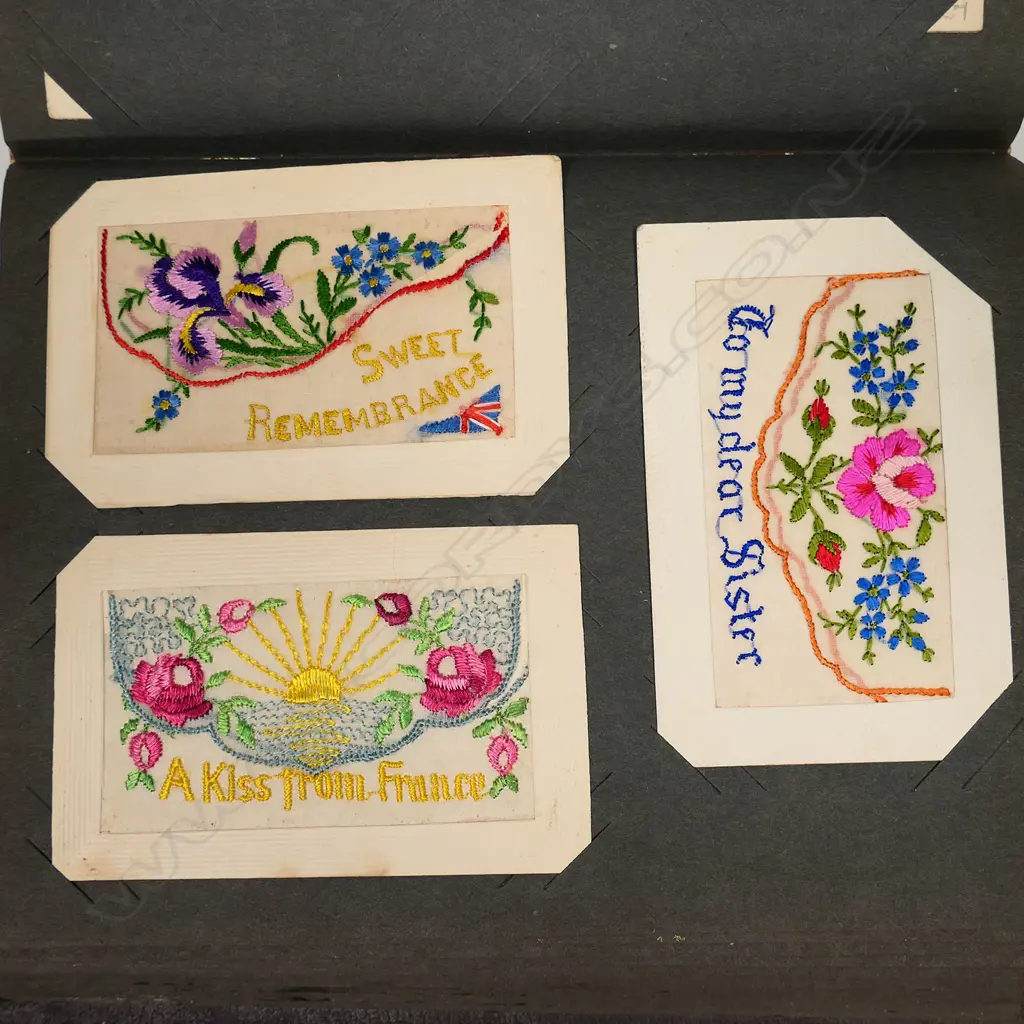 An early 20thC postcard album, with one hundred and twenty-four silk post cards, including many from WWI, souvenir, greetings and good luck cards, all in good condition. Image 1++