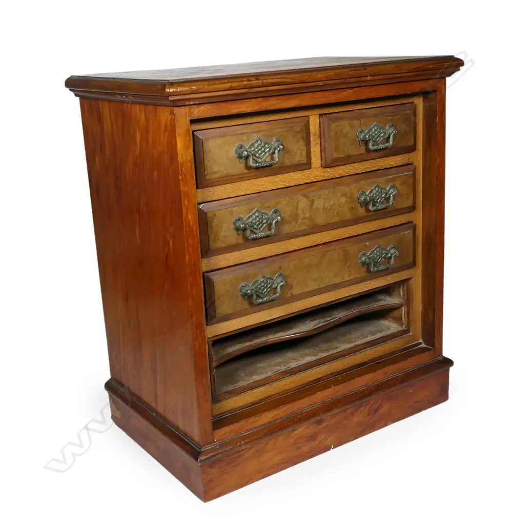 A colonial kauri apprentice chest, configured with four drawers and slots for paperwork at the base, mixed woods of kauri, totara and rewarewa, raised on plinth base. 440 x 270 x 500mm. Image 1++