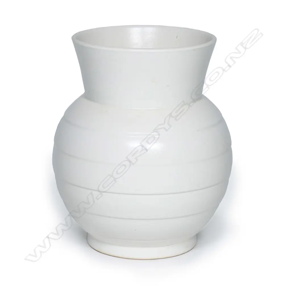 A Crown Lynn 'Hand Potted' vase, shape #24 with lathe banded spherical body and open flared neck, matt white glaze, printed and incised marks to base. H.185mm. Image 1++