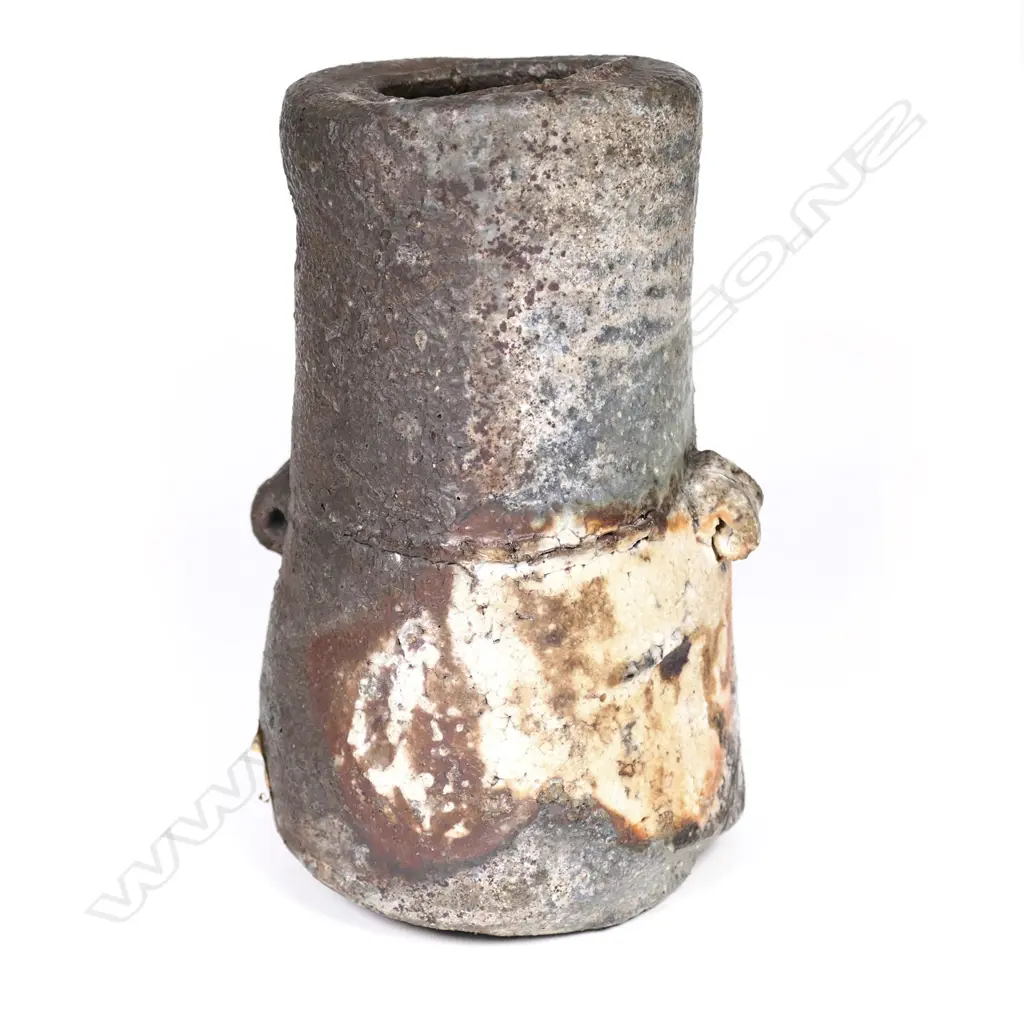 Chester Nealie anagama fired vase, small lug side handles, streaks of grey/green heavy glaze, impressed leaf patterns. Incised potter's marks and with paper label. H.255mm. Image 1++