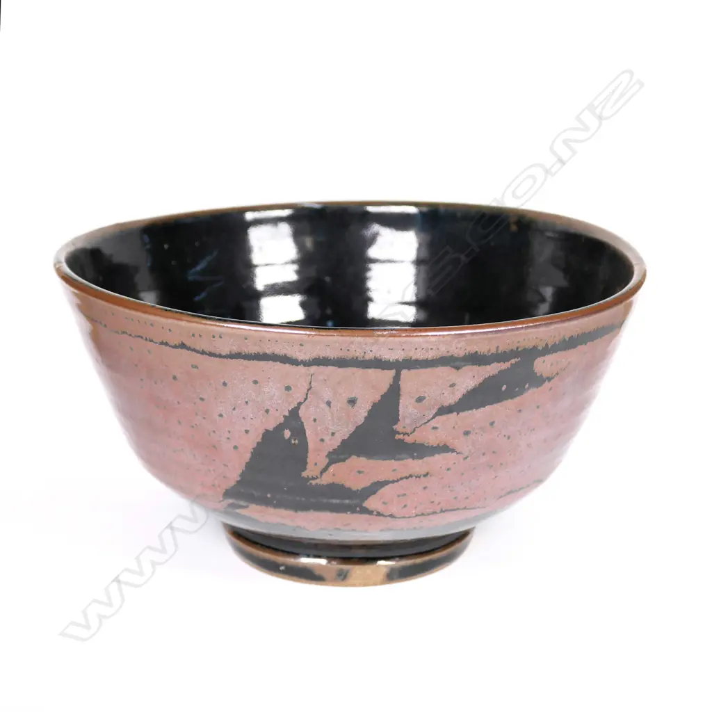 Warren Tippett wax resist tenmoku bowl, leafy sprig decoration. Impressed potter's mark, Coromandel. Dia.225mm. Image 1++