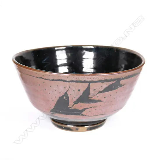 Warren Tippett wax resist tenmoku bowl, leafy sprig decoration. Impressed potter's mark, Coromandel. Dia.225mm.