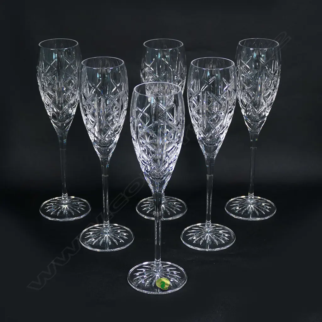 A set of six Waterford crystal champagne glasses, etched marks. Repeat diamond cut panels. Image 1++