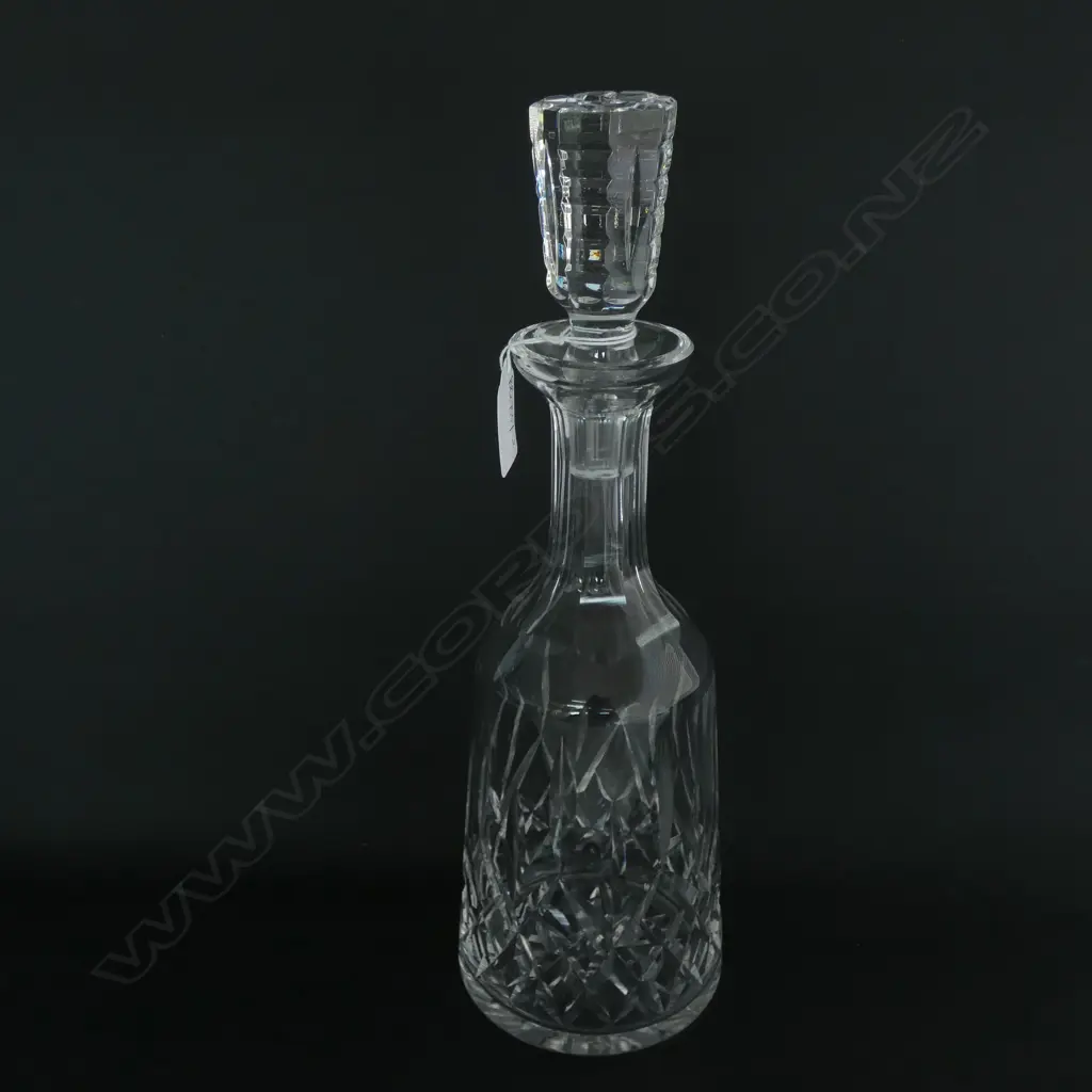 A Waterford 'Lismore' pattern crystal decanter, mallet bodied with conforming stopper. H.335mm Image 1++
