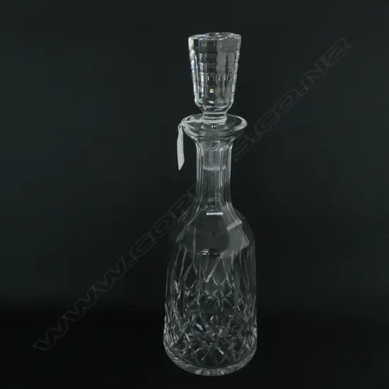 A Waterford 'Lismore' pattern crystal decanter, mallet bodied with conforming stopper. H.335mm