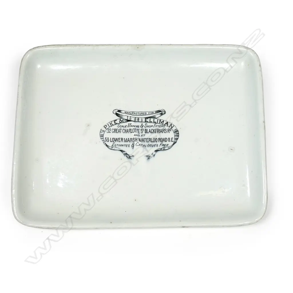 An early 20thC grocery shop glazed porcelain scales platter, oblong slightly dished, printed with shopfitters advertising decal. 375 x 280mm. Old chip to base. Image 1++