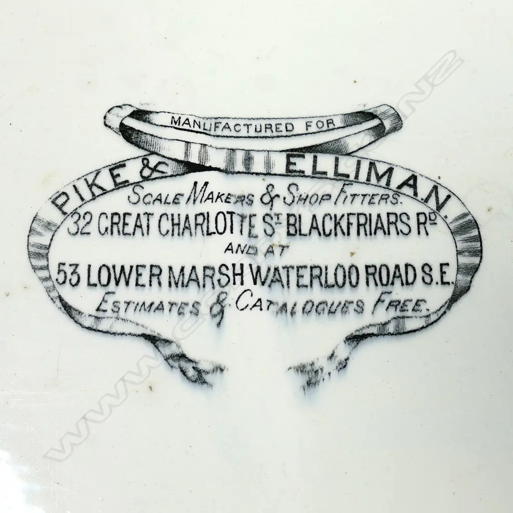 An early 20thC grocery shop glazed porcelain scales platter, oblong slightly dished, printed with shopfitters advertising decal. 375 x 280mm. Old chip to base. Image 1++