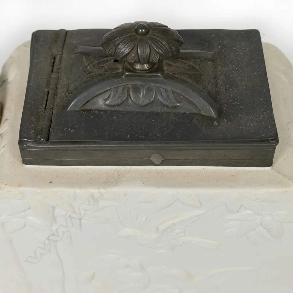 A Copeland salt glaze china Aesthetic period teapot, with pewter mounted cover and decorated with bamboo and birds. Registry mark c.1874. Small hairline at spout. W.255mm Image 1++