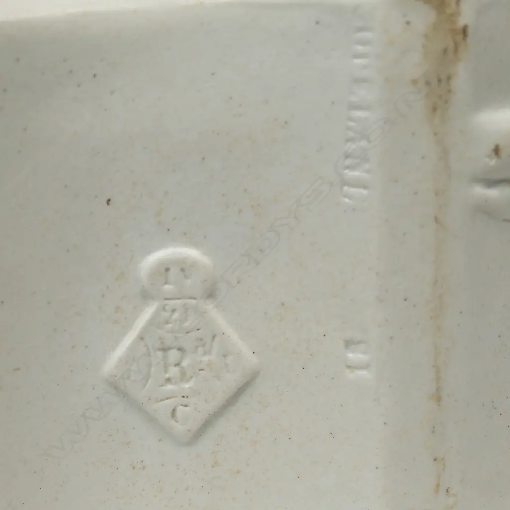 A Copeland salt glaze china Aesthetic period teapot, with pewter mounted cover and decorated with bamboo and birds. Registry mark c.1874. Small hairline at spout. W.255mm Image 1++