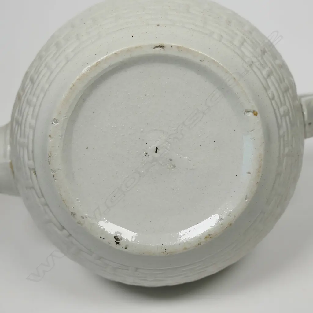 A salt glaze china Victorian period teapot, with pewter mounted cover and decorated with prunus and basket weave. Unmarked. W.230mm Image 1++