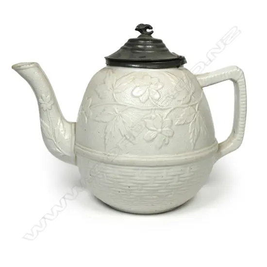 A salt glaze china Victorian period teapot, with pewter mounted cover and decorated with prunus and basket weave. Unmarked. W.230mm