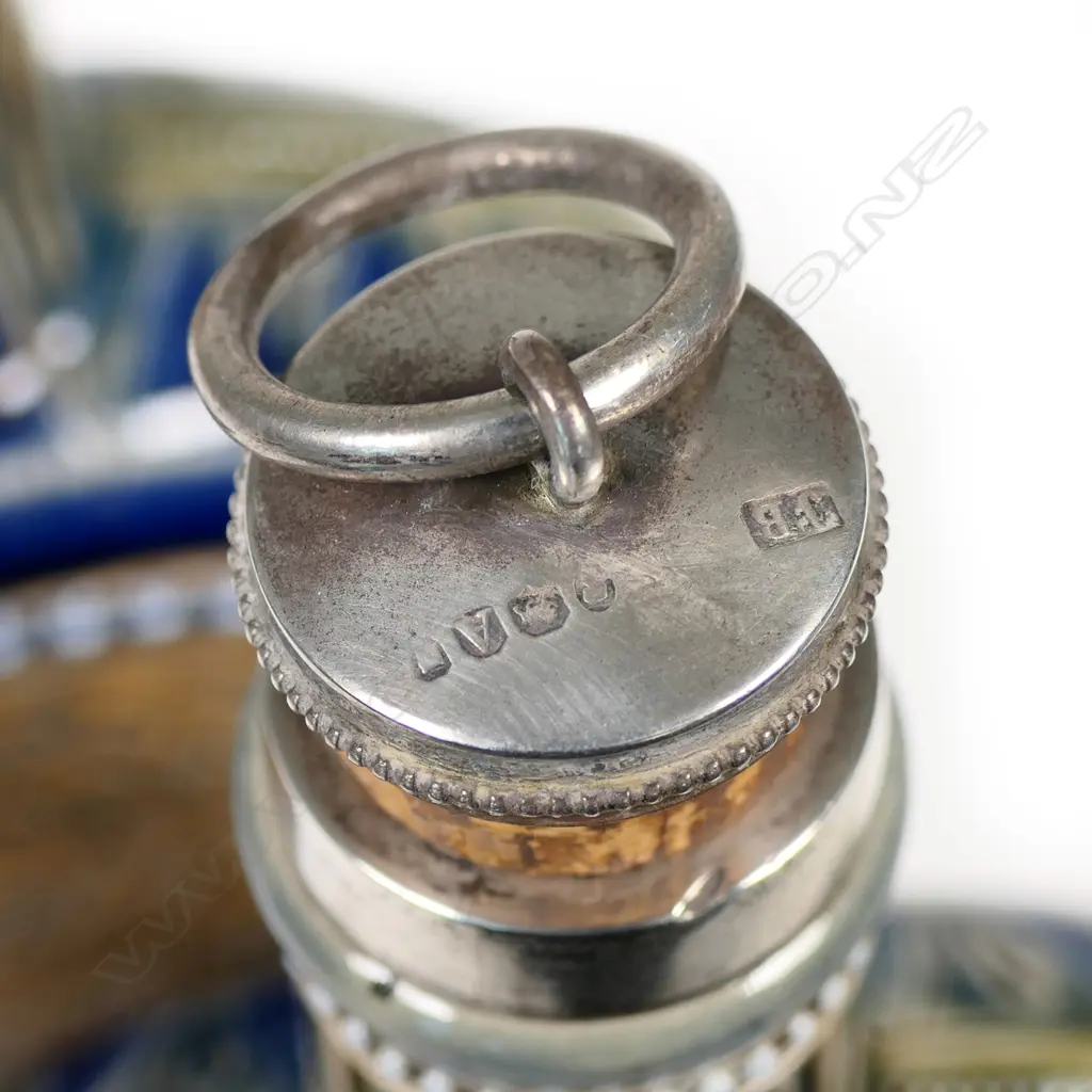 A rare pair of Doulton Lambeth flasks decorated by Hannah Barlow, the disc bodies incised sgrafitto to either side with ponies and horses, stags and hinds. The flasks raised on circular spreading bases (two chips to one and small flake to other) and with short cylindrical necks with silver mounts and ring caps to cork stoppers.  Impressed factory mark and date 1876 along with monograms for Barlow and assisting artists Emily E. Stomer and Emma Martin. Silver hallmarked for London 1876 by Jane Brownett. H.255mm. Image 1++