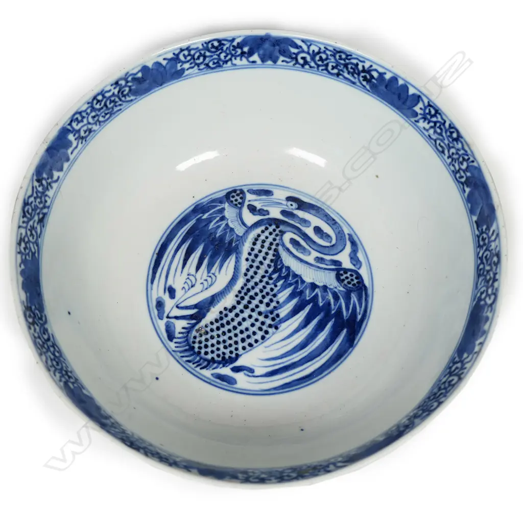 A Chinese Qianlong blue and white phoenix roundel patterned bowl, with cafe-au-lait glaze to the exterior, four -character mark under the base. Dia.240mm Image 1++