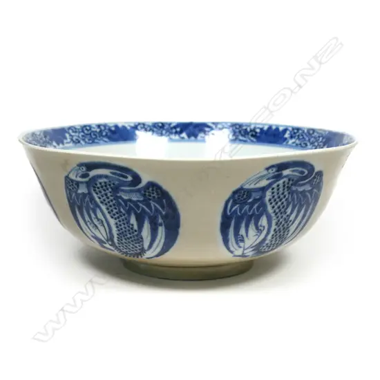 A Chinese Qianlong blue and white phoenix roundel patterned bowl, with cafe-au-lait glaze to the exterior, four -character mark under the base. Dia.240mm