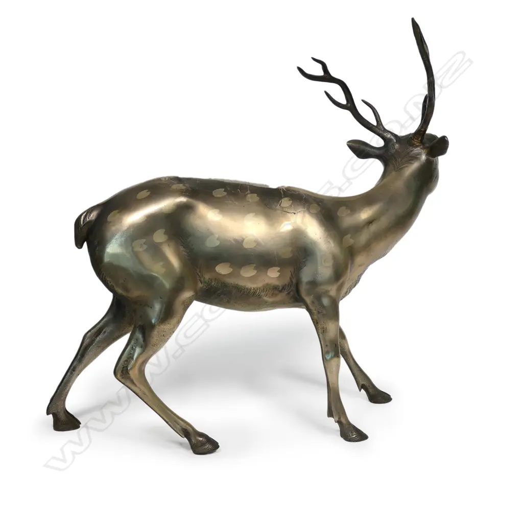 A vintage Chinese gilded bronze of a sage upon a deer, the sage (Shou Lao) with ruji sceptre and scroll, the stag with heart form spotted highlights. Repair to one antler. H.565. L.550mm. Image 1++