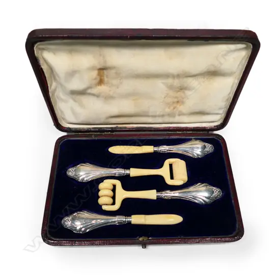 A cased set of four .925 silver handled reflexology implements, the faux ivory tools with Art Nouveau handles.