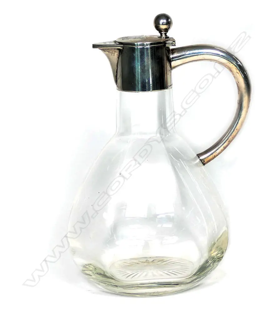 An early 1900 German 800 silver mounted claret jug, undecorated body with plain silver top, monogram to lid, German silver marks. 130 x 110mm. Image 1++