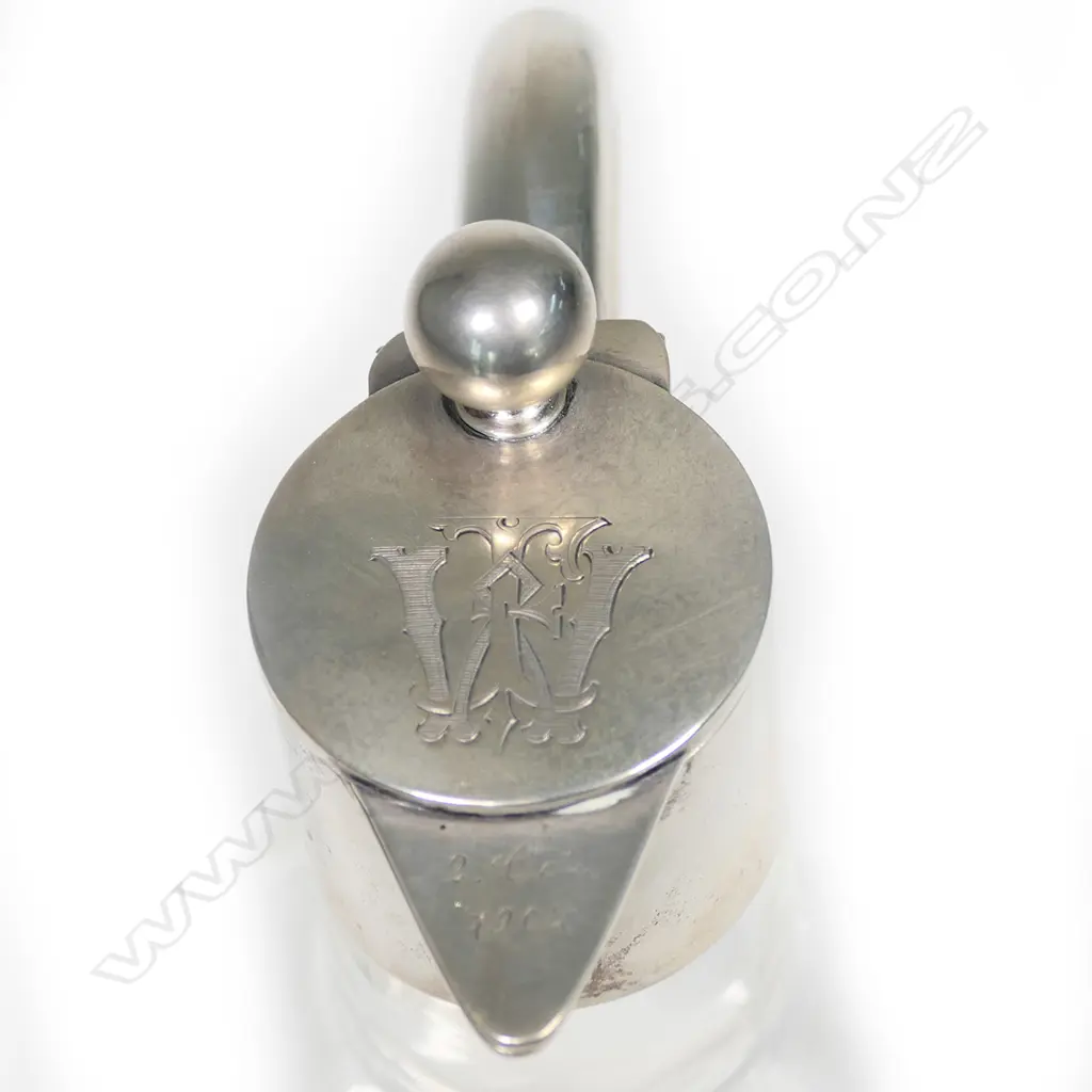 An early 1900 German 800 silver mounted claret jug, undecorated body with plain silver top, monogram to lid, German silver marks. 130 x 110mm. Image 1++