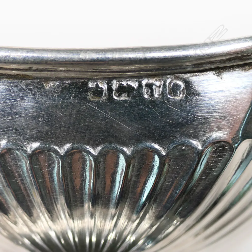 A set of four Vict silver salts, oblong boat shape, fluted, raised on conforming bases. Sheffield 1886 by Levesley Bros. 140gm Image 1++