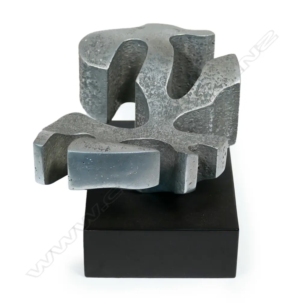 Guy Ngan (1926-2017), sculpture No.2 from the Habitation series 1975, aluminium on ebonised base, impressed artist's name and '2/1975', 175 x 145 x 125mm. Provenance: From the estate of the artist. Exhibited: The Dowse, Guy Ngan: Habitation. 18th May - 15th September 2019. Dunedin Public Art Gallery, Guy Ngan: Habitation. 20th March - 1st July 2021. The Dowse notes: Guy Ngan: Habitation considers how notions of place and belonging influenced his expansive practice, which was grounded in his Chinese heritage, his home in Te Moana nui a Kiwa (the Pacific), and his studies across Aotearoa New Zealand, the United Kingdom and Italy. Image 1++