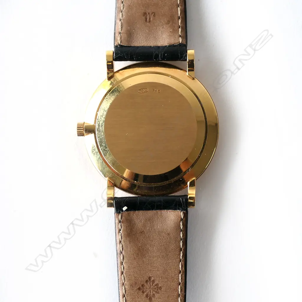 A vintage 18ct gold lady’s Patek Philippe wristwatch, oval case with gilt dial and original 18ct PP integral mesh strap and latch clasp with makers emblem. 41.3gm total. Image 1++