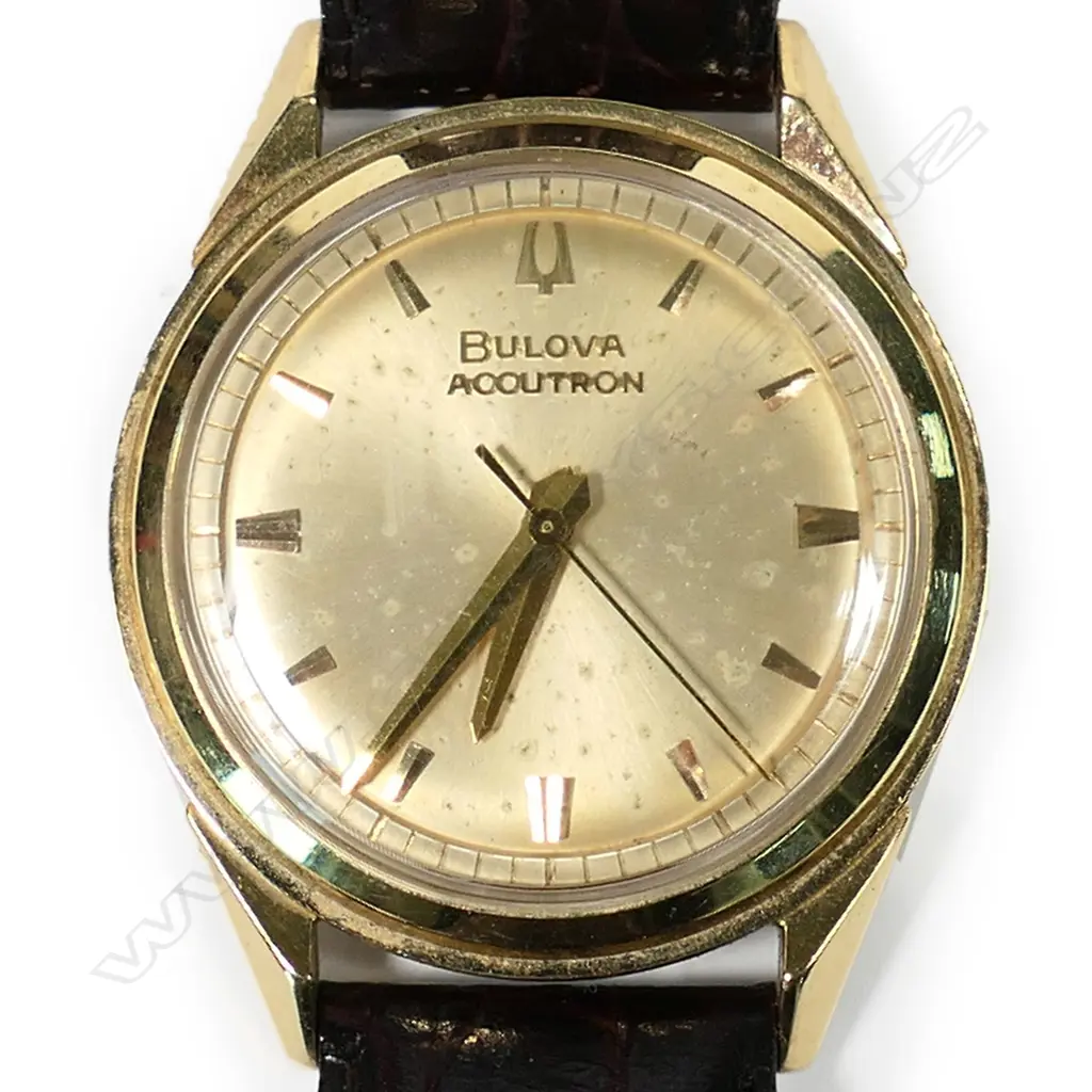 A 1960s Bulova Accutron 18ct gold wristwatch, ref. 214 M1, 34mm case, gold dial with batons indicating hours and railtrack seconds, sweep seconds hand. Signature time setting stem to rear of case. Ser. no. D75957. Not working and requires SR41W battery. Provenance: Private Auckland estate collection. Image 1++