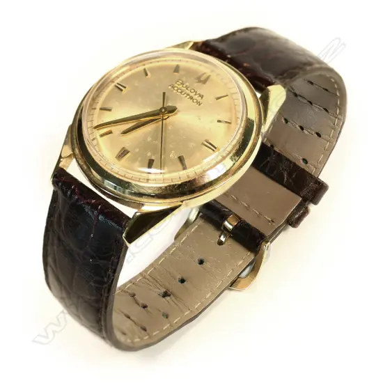 A 1960s Bulova Accutron 18ct gold wristwatch, ref. 214 M1, 34mm case, gold dial with batons indicating hours and railtrack seconds, sweep seconds hand. Signature time setting stem to rear of case. Ser. no. D75957. Not working and requires SR41W battery. Provenance: Private Auckland estate collection.