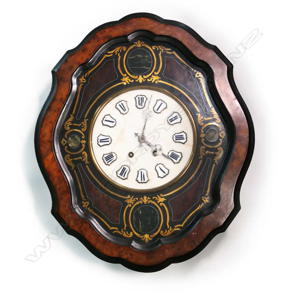 A 19thC French country wall clock, with serpentine oval 'picture frame' case, glazed and displaying a bezel set with decorative agate panels framing a marble dial (repaired) with enamel cartouche hours. Gong striking movement requires attention. 605 x 505mm. Provenance: The estate collection of Prof. G. Dawson. Image 1++