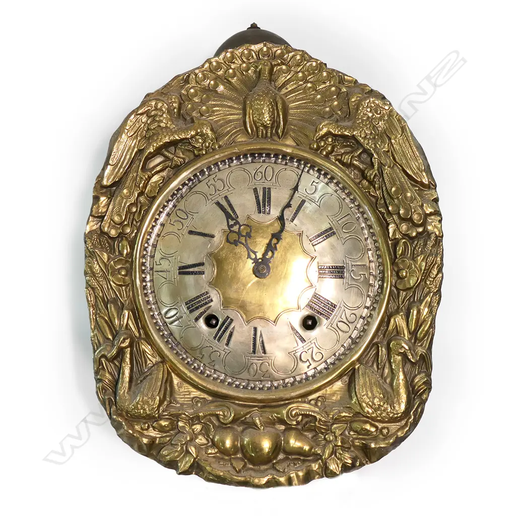 A French comptoise wall clock, the brass face embossed with birds framing the engraved metal dial. Ornate large pendulum, bell striking movement. H.1400mm approx. Provenance: The estate collection of Prof. G. Dawson. Image 1++