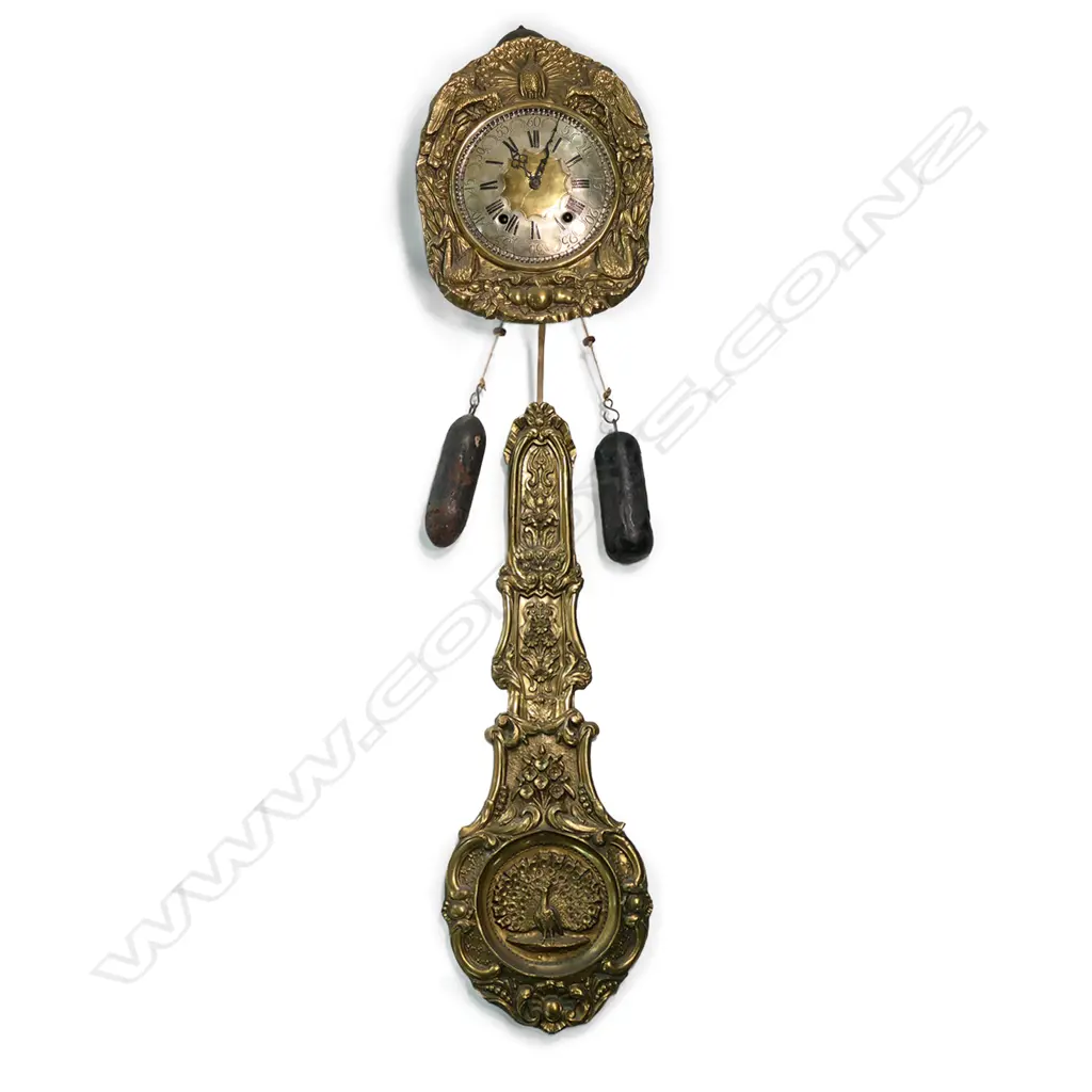 A French comptoise wall clock, the brass face embossed with birds framing the engraved metal dial. Ornate large pendulum, bell striking movement. H.1400mm approx. Provenance: The estate collection of Prof. G. Dawson. Image 1++