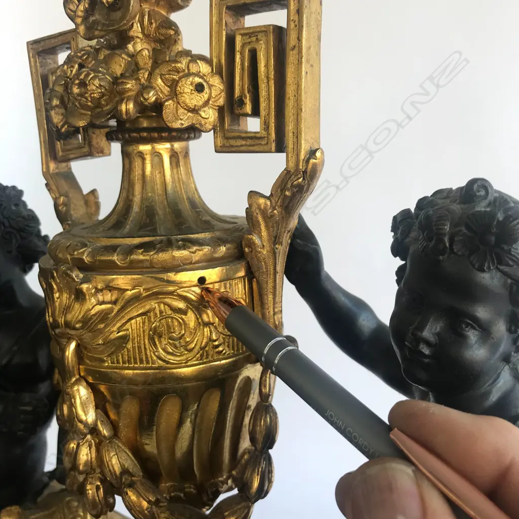 A monumental cased French mantel clock, in ormolu and bronze Image 1++