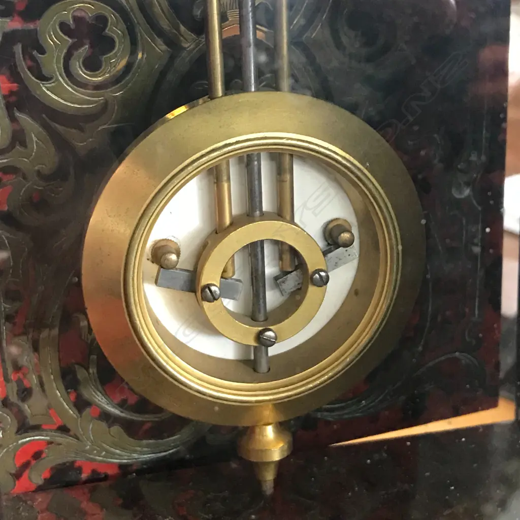 A French 19thC red tortoiseshell lacquer and boulle cut brass inlay mantel clock Image 1++