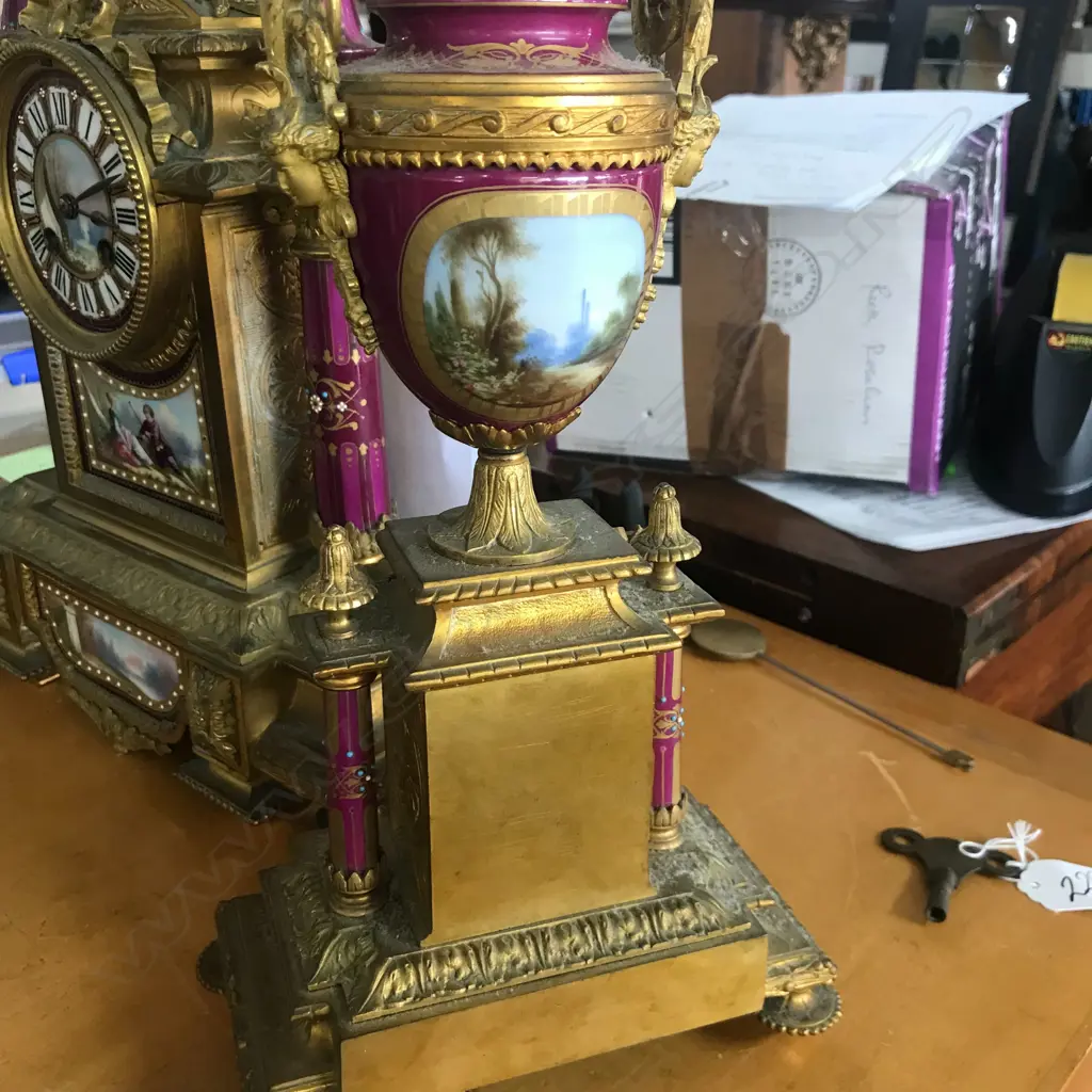 A good French 19thC ormolu and porcelain three-piece clock garniture Image 1++
