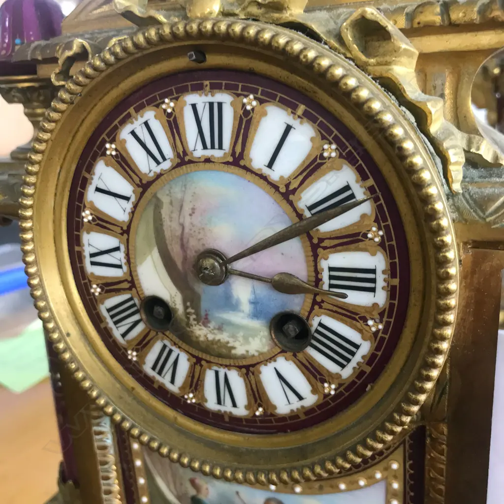 A good French 19thC ormolu and porcelain three-piece clock garniture Image 1++