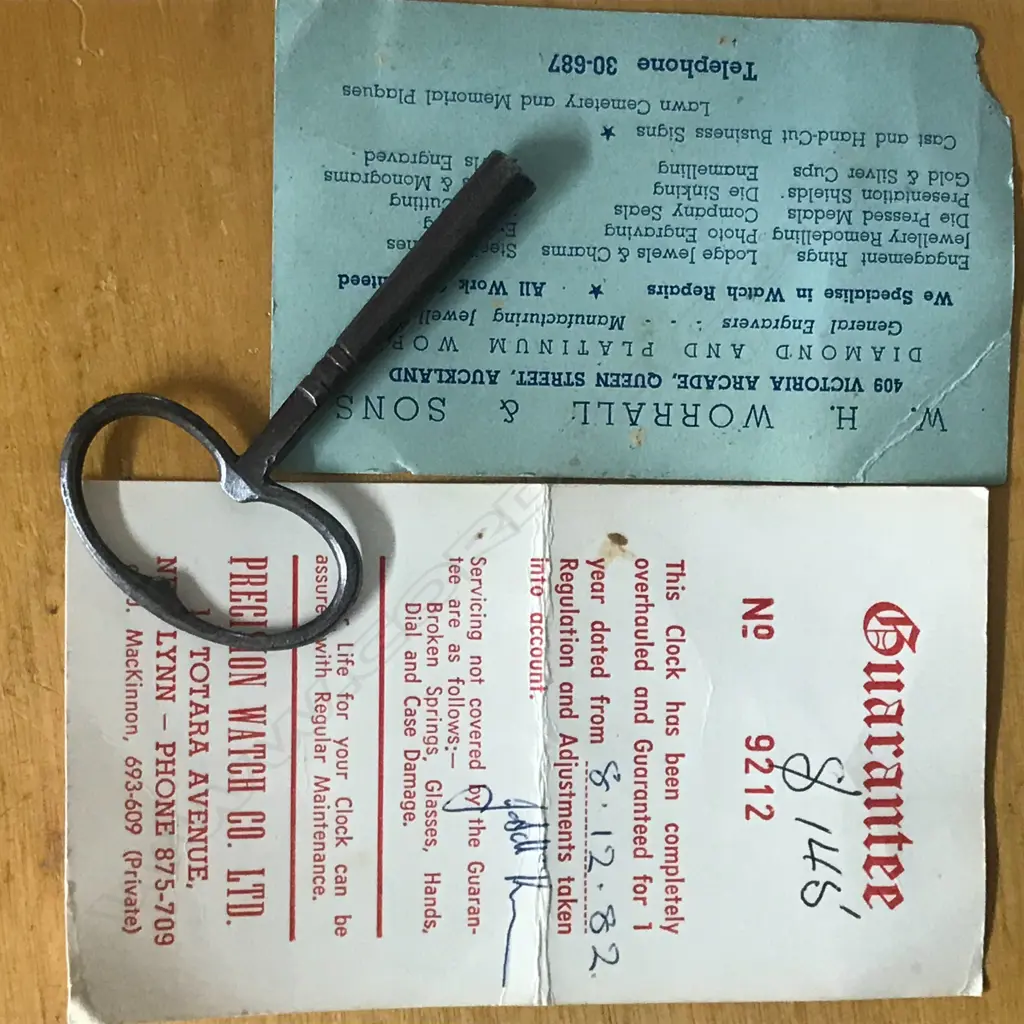 A Louis XVI-style mantel clock, the shaped case inlaid with cut brass Boulle work on black lacquered ground and heavily tarnished rococo ormolu mounts, surmounted by a pagoda top crowned by a standing heraldic angel figure. The cast dial with white enamel hour cartouches with blue Roman numerals, gong striking movement, sunburst pendulum above a sloping checkered floor, behind a glazed door mounted with a floral adorned putti. H.640mm. Image 1++