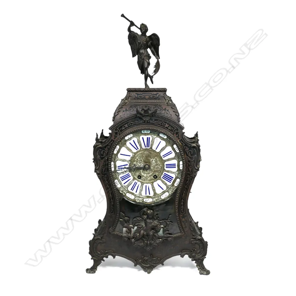A Louis XVI-style mantel clock, the shaped case inlaid with cut brass Boulle work on black lacquered ground and heavily tarnished rococo ormolu mounts, surmounted by a pagoda top crowned by a standing heraldic angel figure. The cast dial with white enamel hour cartouches with blue Roman numerals, gong striking movement, sunburst pendulum above a sloping checkered floor, behind a glazed door mounted with a floral adorned putti. H.640mm. Image 1++