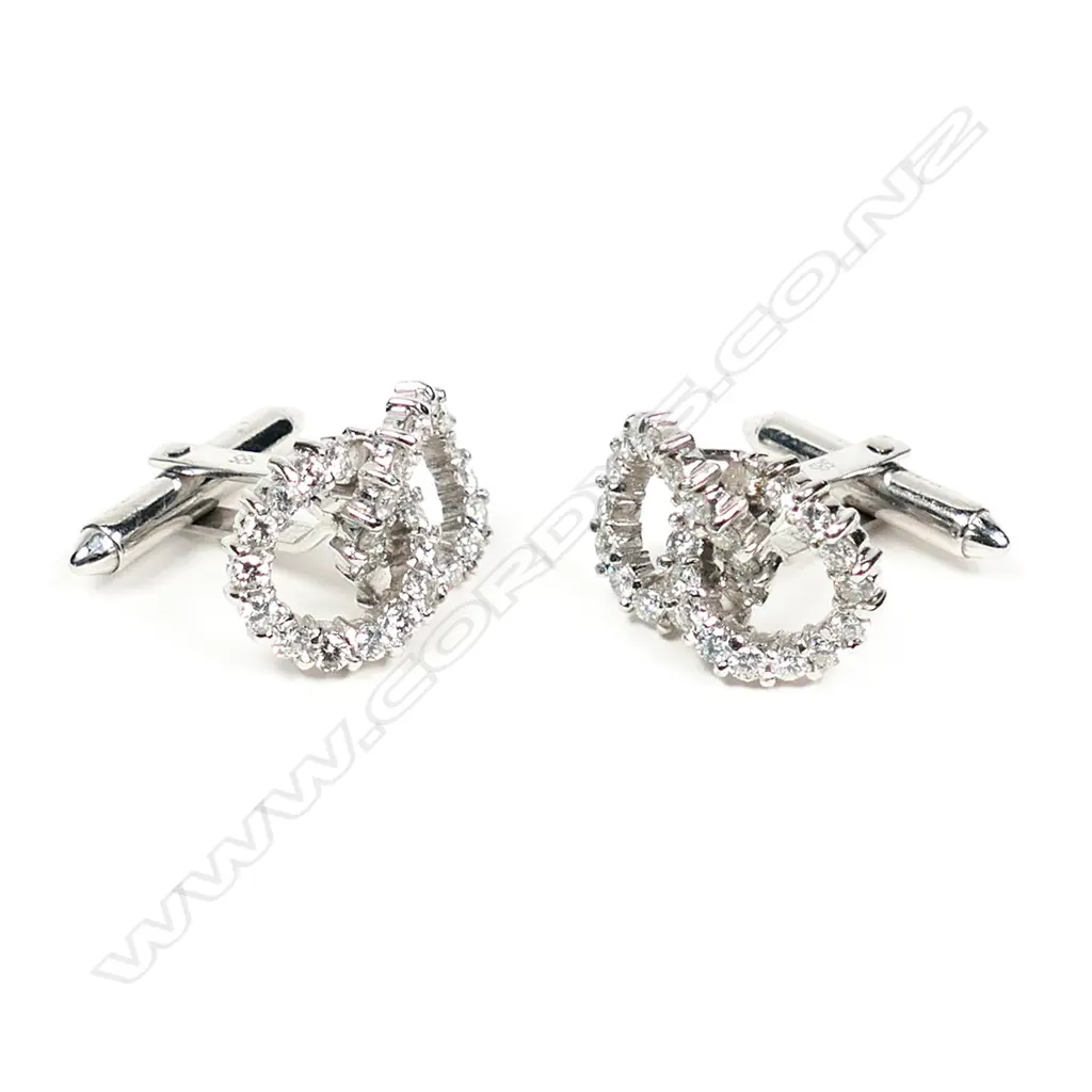 A pair of diamond set 14ct white gold double circlet cufflinks, each of two interlocked circles set with 28 round brilliant cut diamonds on hinged bar backs. The 56 diamonds of approx. TDW 2.20ct. Valuation available. Image 1++