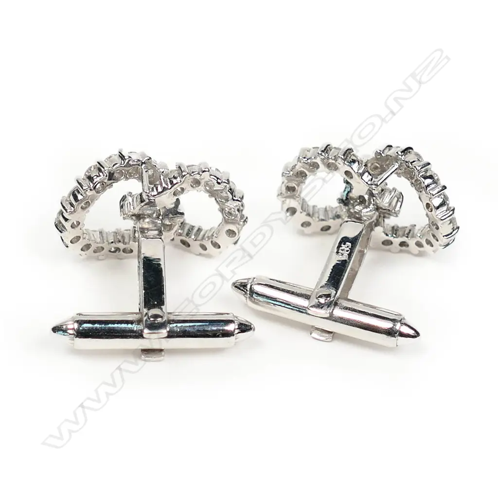 A pair of diamond set 14ct white gold double circlet cufflinks, each of two interlocked circles set with 28 round brilliant cut diamonds on hinged bar backs. The 56 diamonds of approx. TDW 2.20ct. Valuation available. Image 1++