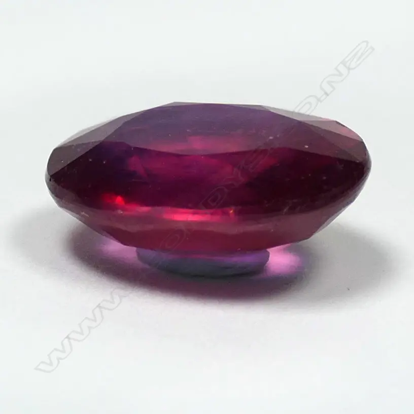 A natural 10.39ct loose ruby gemstone, oval facet cut. With AIG certificate stating 'Comments: HT (Pb). Indications of clarity enhancement with lead glass'. Image 1++