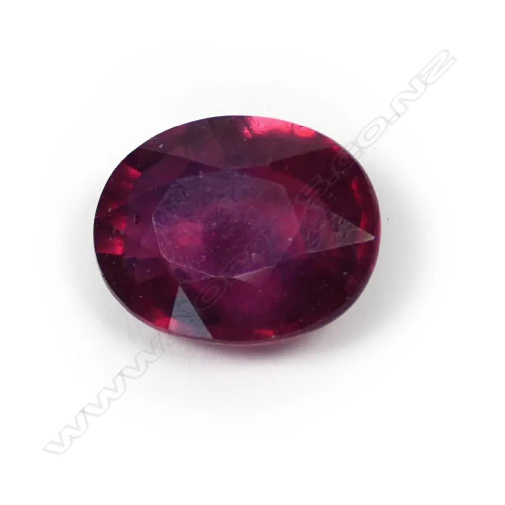 A natural 10.39ct loose ruby gemstone, oval facet cut. With AIG certificate stating 'Comments: HT (Pb). Indications of clarity enhancement with lead glass'. Image 1++