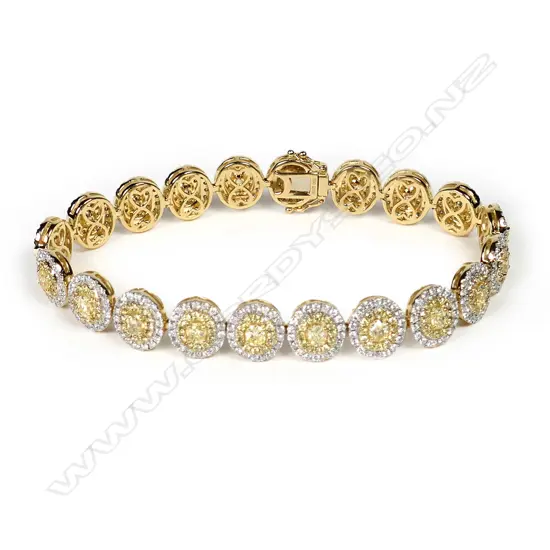 An 18ct white gold and yellow and white diamond bracelet