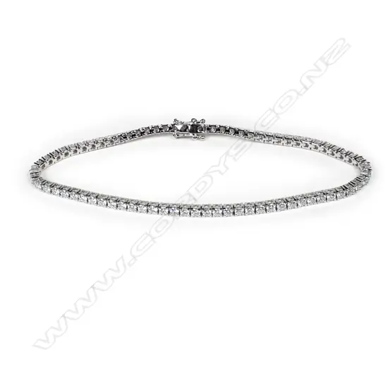 An 18ct white gold and diamond tennis bracelet, round brilliant cut diamonds claw set, push clasp with two safety catches, TDW 2.82ct.
