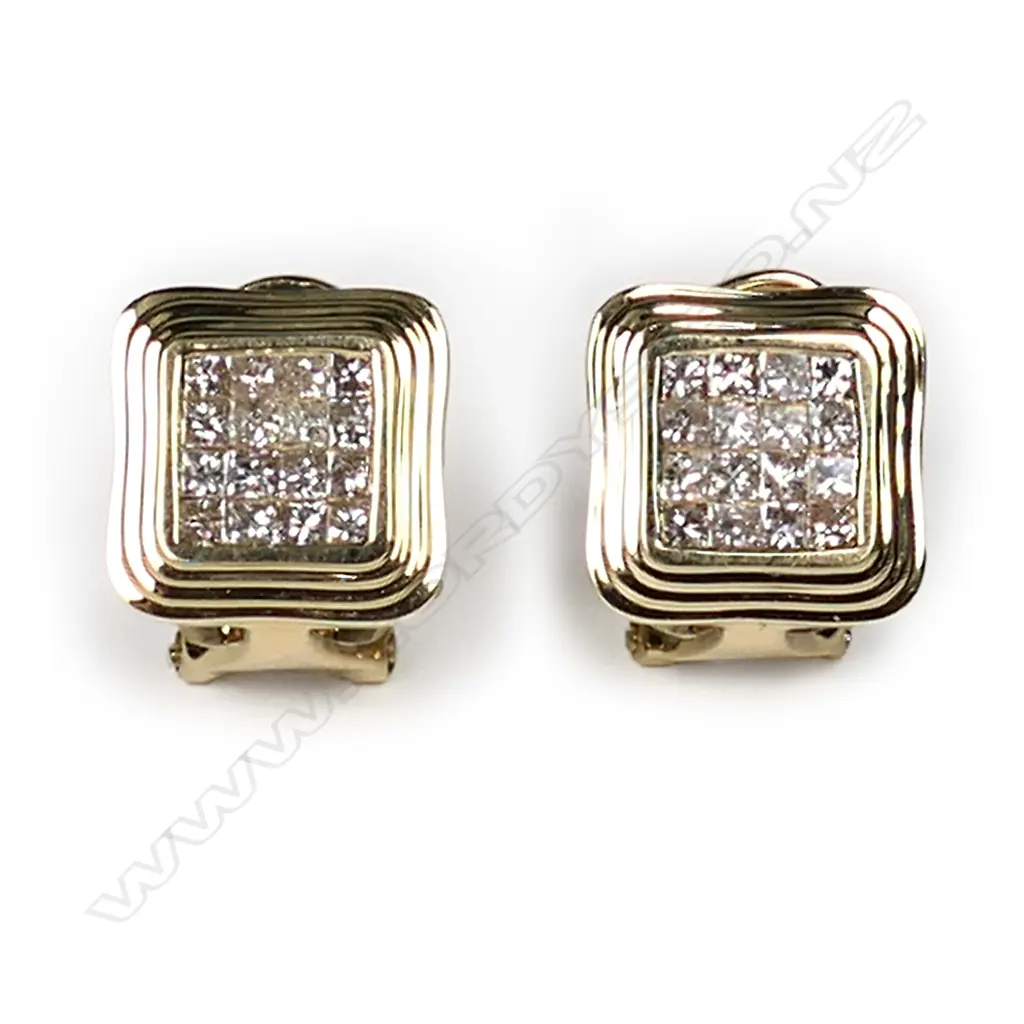 A pair of 18ct yellow gold and diamond stud earrings, each earring set with sixteen princess cut diamonds in a square mount with fluted decoration, posts for pierced ears with safety clips, TDW 0.74ct. Image 1++