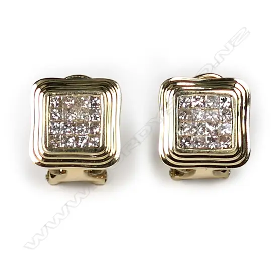 A pair of 18ct yellow gold and diamond stud earrings, each earring set with sixteen princess cut diamonds in a square mount with fluted decoration, posts for pierced ears with safety clips, TDW 0.74ct.