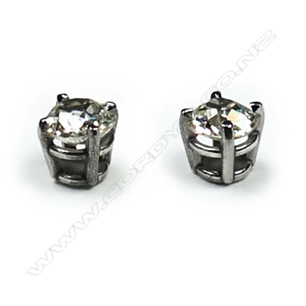 A pair of platinum and diamond stud earrings, each earring set with a 0.35ct old cut diamond, Colour L-N, Clarity SI1-2.  Valuation available. Image 1++