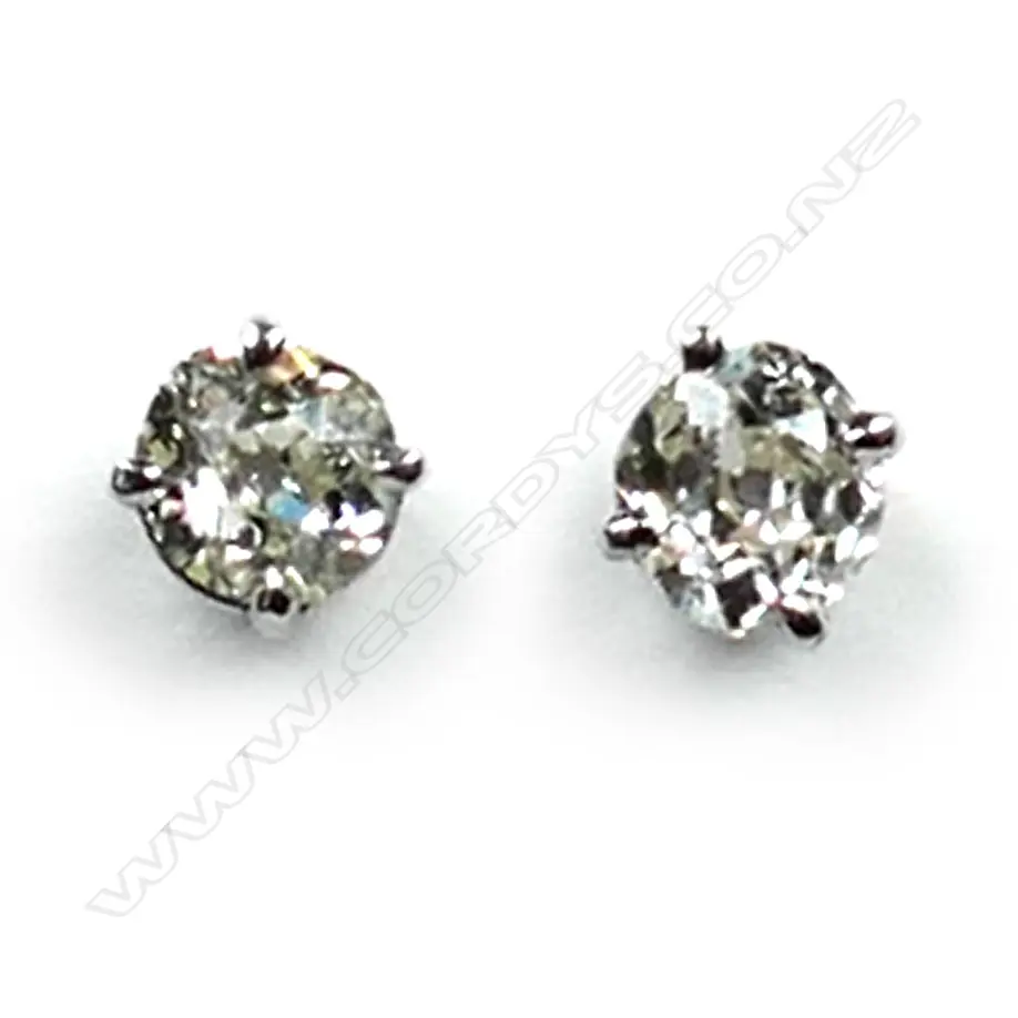A pair of platinum and diamond stud earrings, each earring set with a 0.35ct old cut diamond, Colour L-N, Clarity SI1-2.  Valuation available. Image 1++