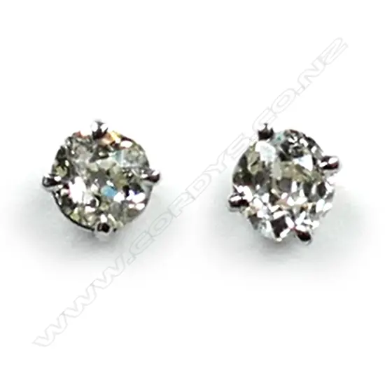 A pair of platinum and diamond stud earrings, each earring set with a 0.35ct old cut diamond, Colour L-N, Clarity SI1-2.  Valuation available.