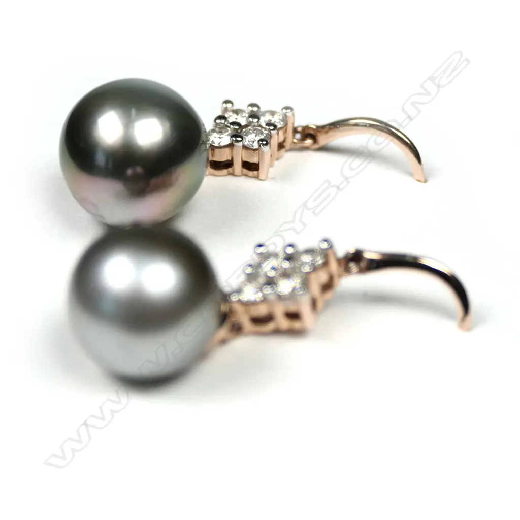 A pair of 14ct rose gold and cultured Tahitian pearl drop earrings, each earring set with a round, grey cultured Tahitian pearl, suspended from four round brilliant cut diamonds (L-M colour, SI2 clarity) earrings with hooks for pierced ears, TDW 0.50ct. Image 1++